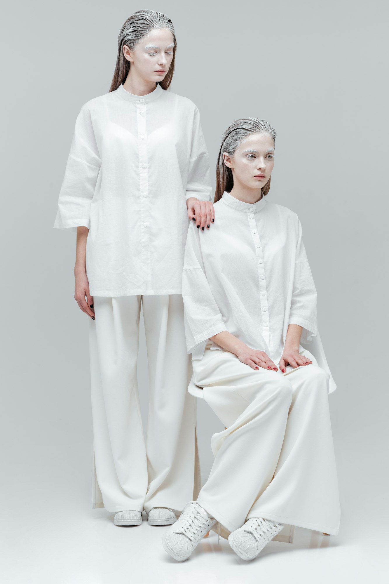 Two women in white fashion clothes